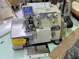 a sewing machine that is sitting on a table in a room