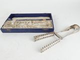 an antique silverware set in a blue box on a white surface