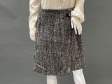 an image of a mannequin wearing a skirt and blouse