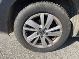 a close up view of a tire on a car