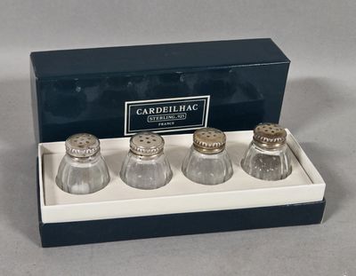 three salt and pepper shakers in a box