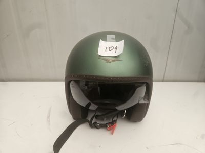 an image of a helmet with a tag on it sitting on a table