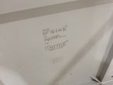 a toilet with a seat that has a sign on it