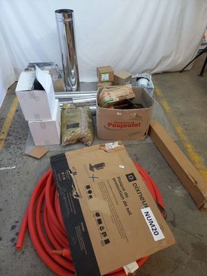 a lot of boxes and hoses sitting on the floor