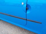 a blue car that is parked on the side of the road