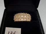 a close up of a ring in a black box with a price tag