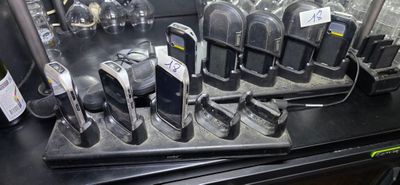 many cell phones that are sitting on a table