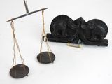 a scale that has a statue on it and a pair of scales on it