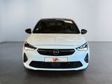 the front view of a white opel parked in a white room