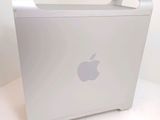 a white apple computer sitting on a white table