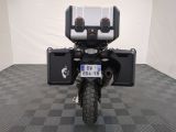 a motorcycle that is parked in a room with a checkered floor