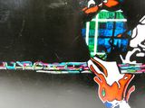 a sticker on the back of a car with a picture of a bird on it