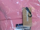 a pink hat that is wrapped in plastic