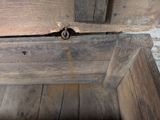 a close up of a wooden door with a latch