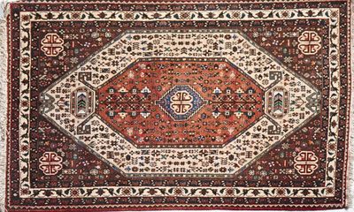 an antique persian rug with a red, white and blue design