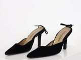the black sued heels are tied up and ready to be worn