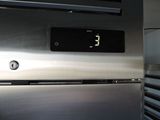 a clock on the side of a stainless steel refrigerator