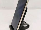 a cell phone that is sitting on top of a stand