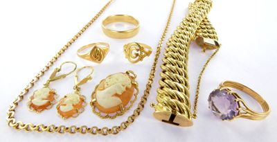 a lot of jewelry that is laying out on the table