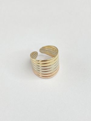 a close up of a gold ring on a white surface