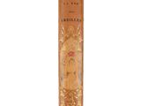 an old book with a gold cover on a white background