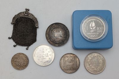 a lot of coins and a purse on the table