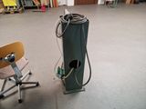 a machine that is sitting on the floor next to a chair