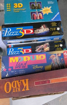 several books are stacked on top of each other in a box