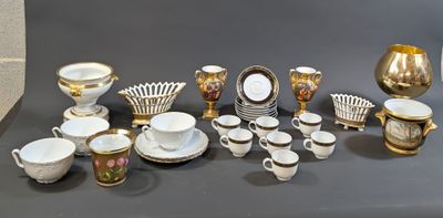 many different types of coffee cups and saucers on the table