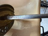 a spoon with a handle that is sitting on a chair