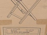 packaging of a folding table in a cardboard box on a table