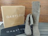 the boots are next to a box of gabylou