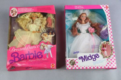 two boxes of barbie dolls are sitting on a table