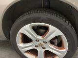 a tire with rust on the rim of a car