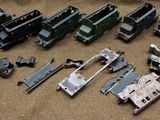 a lot of toy trains that are sitting on the floor