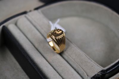 a ring that is sitting in a case on a table