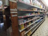 many shelves in the store that are full of food