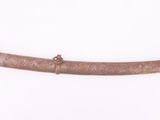 a small wooden sword with a brass handle on a white background