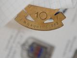 a close up of a badge on a piece of paper