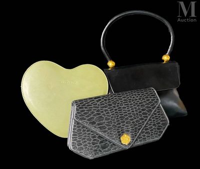 a black purse and a yellow purse on a black background