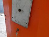 an orange door with a hole in the middle of it