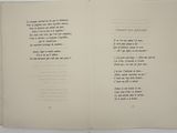 an open book with a poem on it on a table