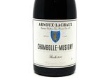 a bottle of wine that is sitting on a table