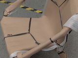 a cardboard chair made to look like a robot