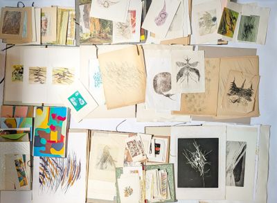 a lot of pictures on the wall of a room