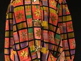 an image of a multicolored shirt on a mannequin stand