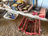 many different tools on a shelf in a garage
