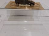 a small toy truck that is on display in a glass case