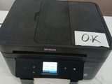 a printer that is sitting on a table with a price tag in front of it