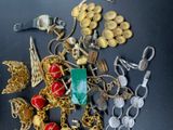 a pile of gold and silver jewelry on a table